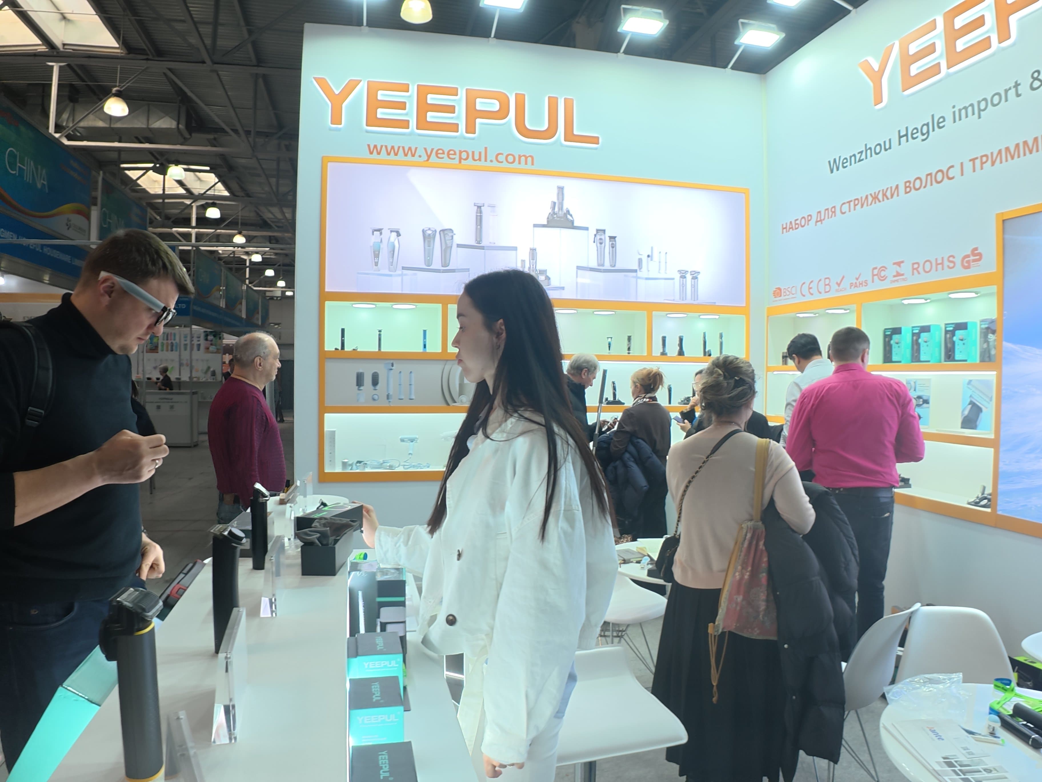 YEEPUL representatives meeting visitors at a personal care appliance exhibition